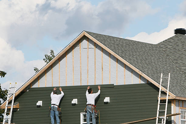 Professional Siding technician working in East Bend, NC